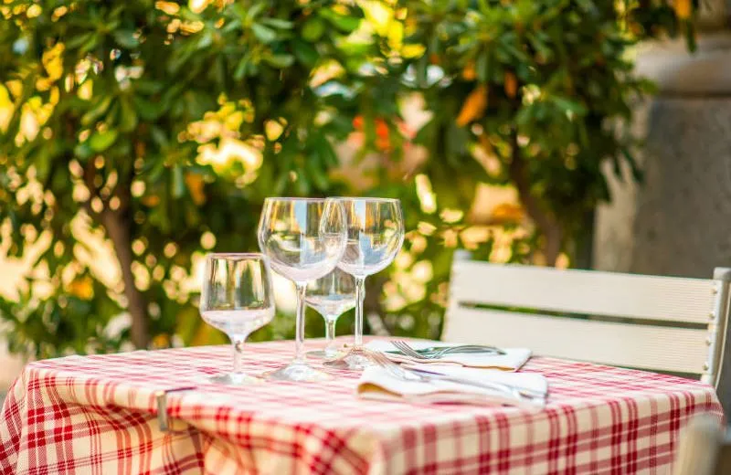 A table set at La Cadrega on a summer evening
